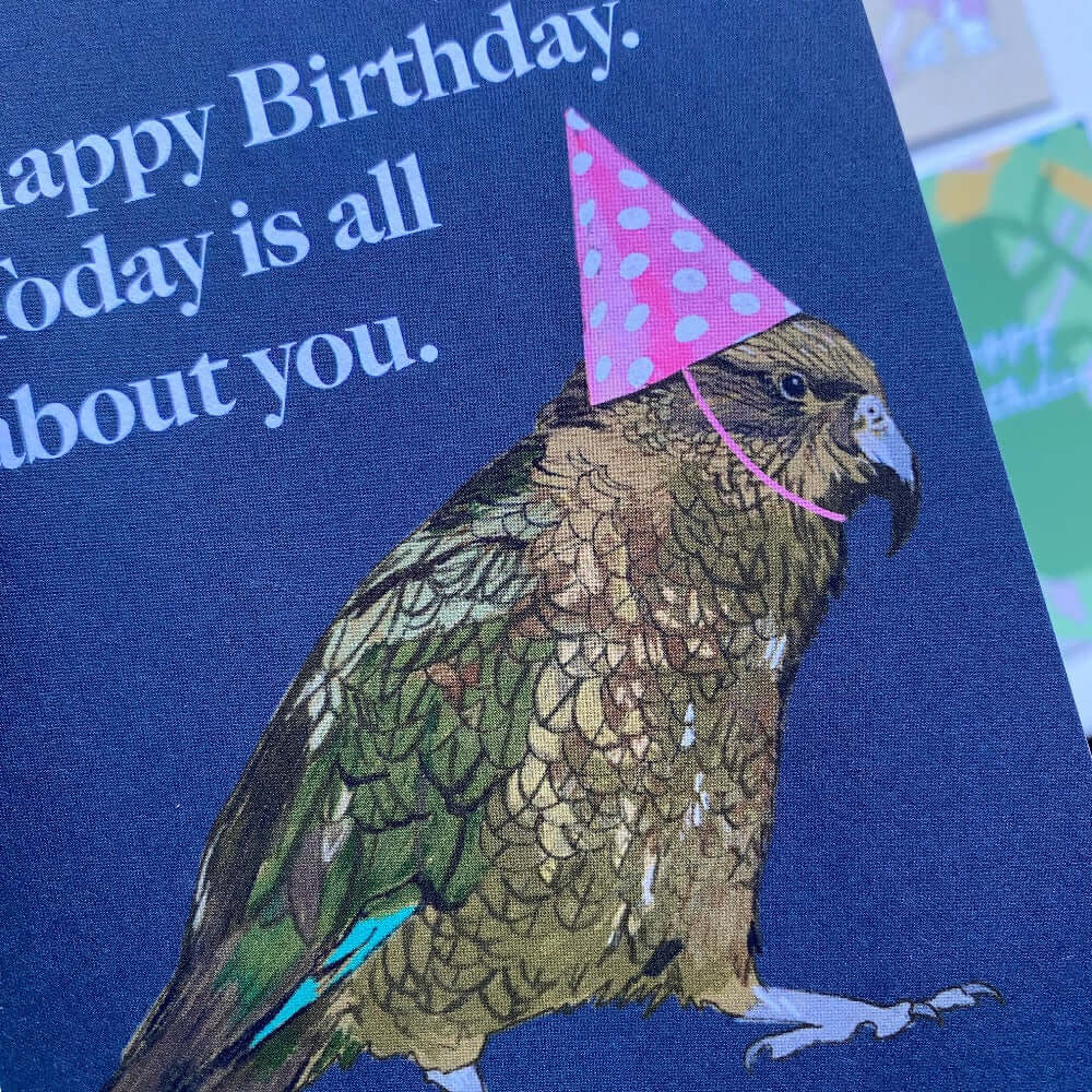 grumpy birthday kea close up